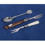 A silver pickle fork, fruit fork and a spoon