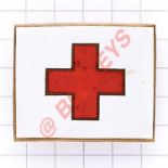 WW1 Red Cross Overseas Ambulance driver’s cap badge. White enamel rectangle, the centre bearing