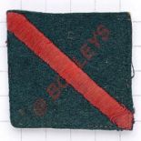 570th LAA Searchlight Regiment RA embroidered cloth formation sign. Red diagonal bar on green felt