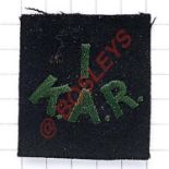 1 / K.A.R. scare 1st King’s African Rifles pagri flash. Green letters embroidered in black.