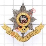 Worcestershire Regiment Officer's forage cap badge circa 1900-26. A fine die-cast silvered and