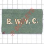 India WW2 Bombay Women’s Volunteer Corps Cloth Uniform Badge. White embroidered letters in green