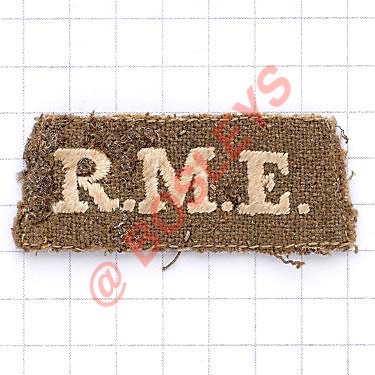 R.M.E. (Royal Marine Engineers) scarce WWI slip-on title. White embroidered on khaki Canvas tape