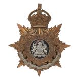 Badge. Manchester Regiment Officer’s helmet plate circa 1901-14. A good gilt example. Crowned star