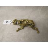 A 19th century French bronze figure of a reclining dog, with glass eyes, signed Maison Alph