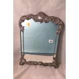 An Edwardian silver strut toilet mirror having a silver frame, London 1912