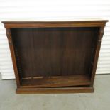 A 19th century walnut open bookcase having adjustable shelves on a plinth base