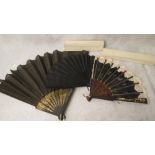 Two French 19th century mother of pearl fans with painted fabric panels, boxed, three other 19th