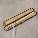 A 1920s Austrian silver enamel and Bakelite cased cigarette holder