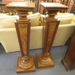 A pair of early 20th century parquetry vase stands, on plinth bases