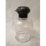 An Edwardian engraved and cut glass dressing table bottle with inlaid tortoiseshell collar and