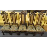 Set of five Charles II style oak framed and caned chairs with high backs, carved front legs and