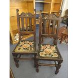 Pair of 17th century oak back stools, carved crest rails flanked by scrolled horns, solid seats with