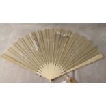 19th century French ivory fan with plain guards and sticks, the panel painted with a girl in a swing