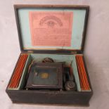 A 19th century Laterna Magica boxed magic lantern with slides