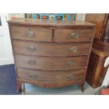 A 19th century mahogany bow fronted chest of two short and three drawers on bracket feet, together