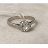An 18ct white gold diamond solitaire ring set with an old cushion mine cut diamond, approximately