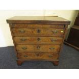 Edwardian walnut gentleman's dressing chest, fold over top flanked by lopers, above four graduated