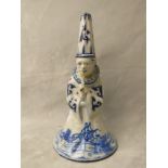 Late 18th/19th century Dutch Delft pottery figural bell in the form of a clown, decorated in blue