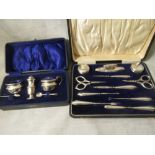A cased silver cruet set together with a cased silver manicure set