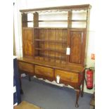 A Stewart Linford burr elm and yew wood dresser, the top with partial open back below a shaped
