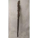 A Maori carved wooden staff set with abalone shell discs A/F
