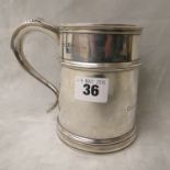 An early 20th century Goldsmiths and Silversmiths silver tankard, Britannia hallmarks for 1921,