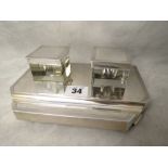 An art deco silver ink stand with two glass inkwells having silver tops (one a replacement) and a