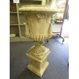A single contemporary cast Campana urn on stand