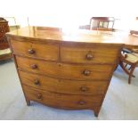 A mahogany bow front chest of two short and three long drawers