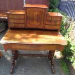 A Victorian mahogany ladies writing desk with raised back on turned supports