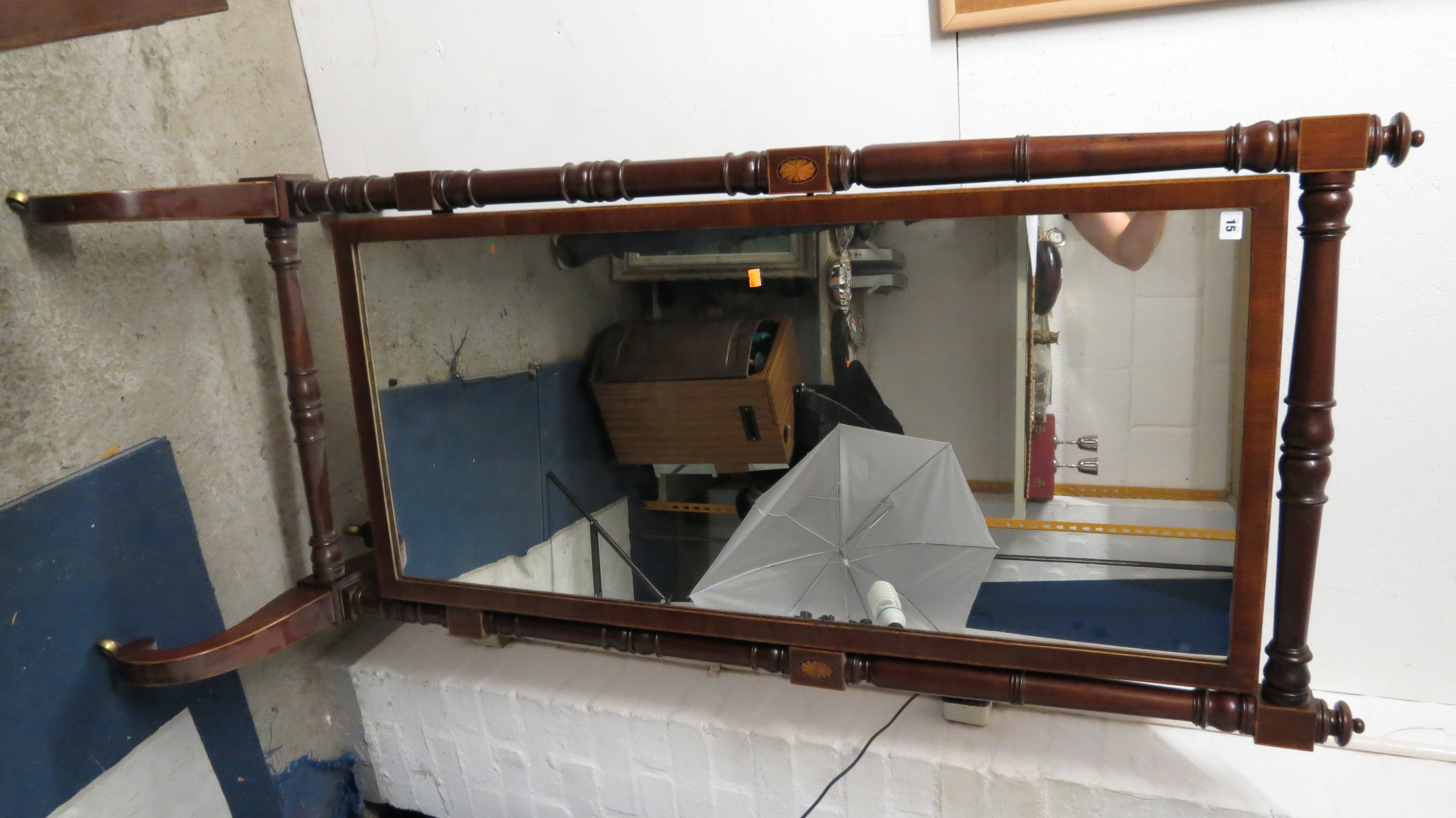 An Edwardian mahogany Sheraton revival cheval mirror standing on castors, 69 1/4 x 29 3/4