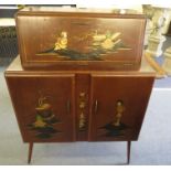 A 1950s retro japanned cocktail cabinet having a fitted interior on splayed legs