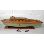 Early 20th century wooden model boat with inboard petrol motor, on stand, 31 long, with two model