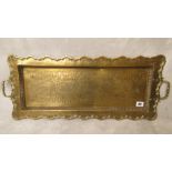 An early 20th century Chinese brass tray of rectangular form, engraved dragon decoration, twin