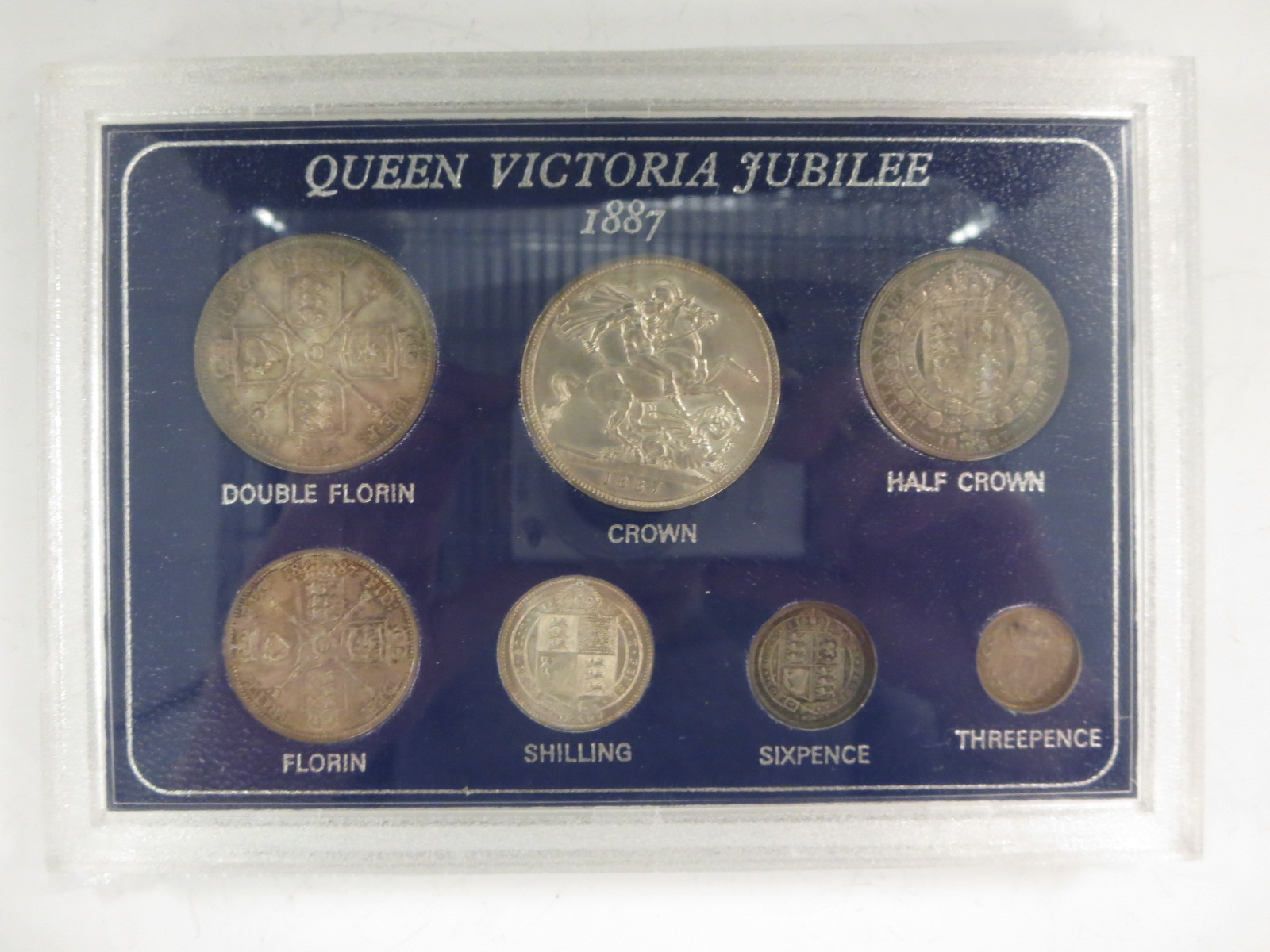 An 1887 silver type Set 3d-5/-, mostly in higher grades, in a modern plastic case