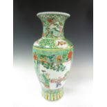 A Chinese polychrome baluster Vase painted panels of figures amongst flowering shrubs, 16in