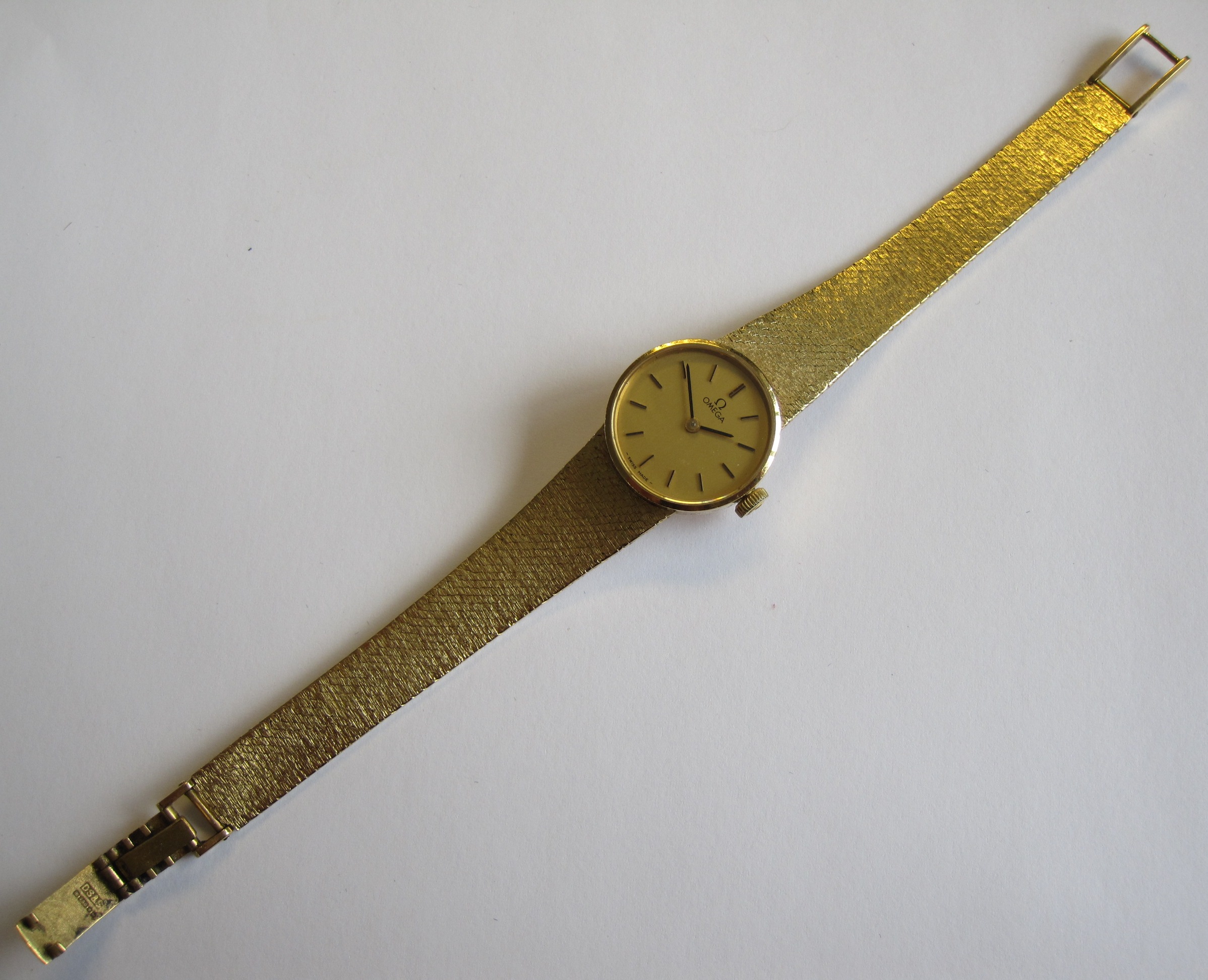 A Lady's Omega Wristwatch the champagne dial with applied gold baton hourly markers on textured - Image 2 of 2