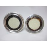 Two silver and tortoiseshell circular Photograph Frames with ribbon and floral designs, Sheffield