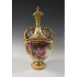 A Royal Worcester two handled Vase and Cover with reeded neck, handles with mask and leafage