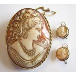 A carved shell Cameo Brooch of bust in profile in rope twist gold frame and a pair of carved shell