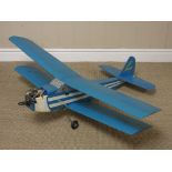 A radio controlled blue Bi-plane with petrol motor and servos, 3ft 10in wingspan