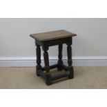 An antique oak Joint Stool with moulded top on turned supports and squared stretchers