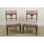 A pair of late Victorian rosewood framed Occasional Chairs with red and white striped upholstery