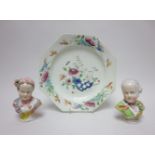 A Bow octagonal Plate floral painted in famille rose enamels, 8 1/4in rim chip and a pair of