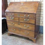 A George III walnut Bureau with finely fitted interior comprising six drawers, four pigeon holes and