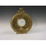 A 19th Century brass cased Easel Mantel Clock with moulded circular frame, white enamel dial with