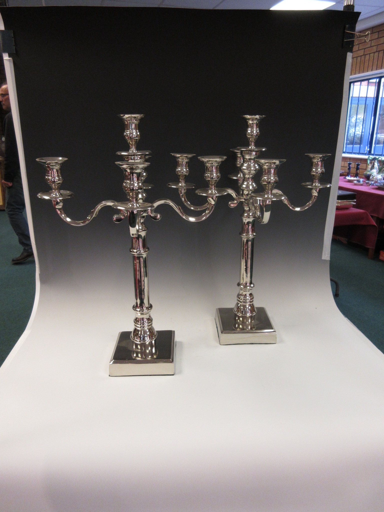 A pair of plated four branch, five light Candelabra on square bases, 22in