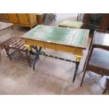 A Regency style satinwood, ebonised and parcel-gilt Writing/Games Table with inset green leather