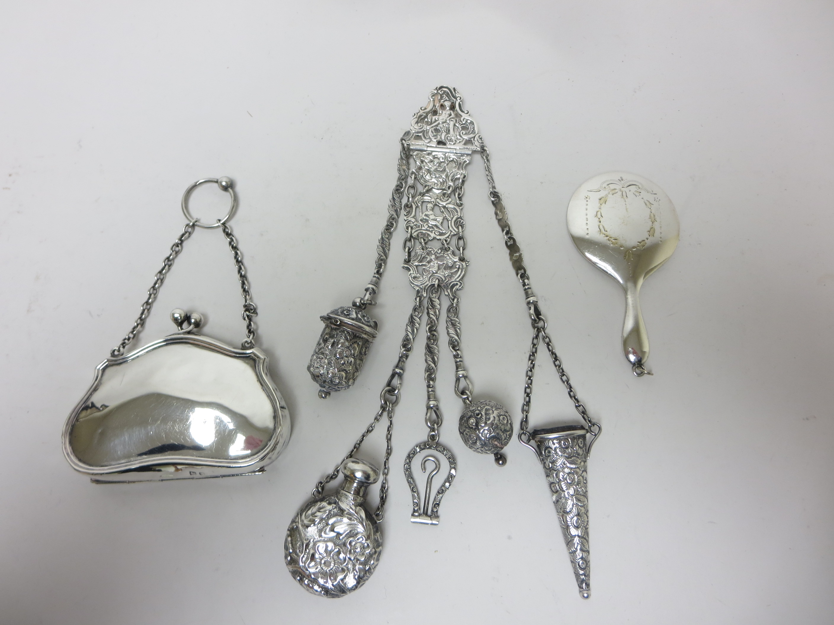 A Victorian silver Chatelaine with embossed scent bottle, button hook, scissors, thimble case,